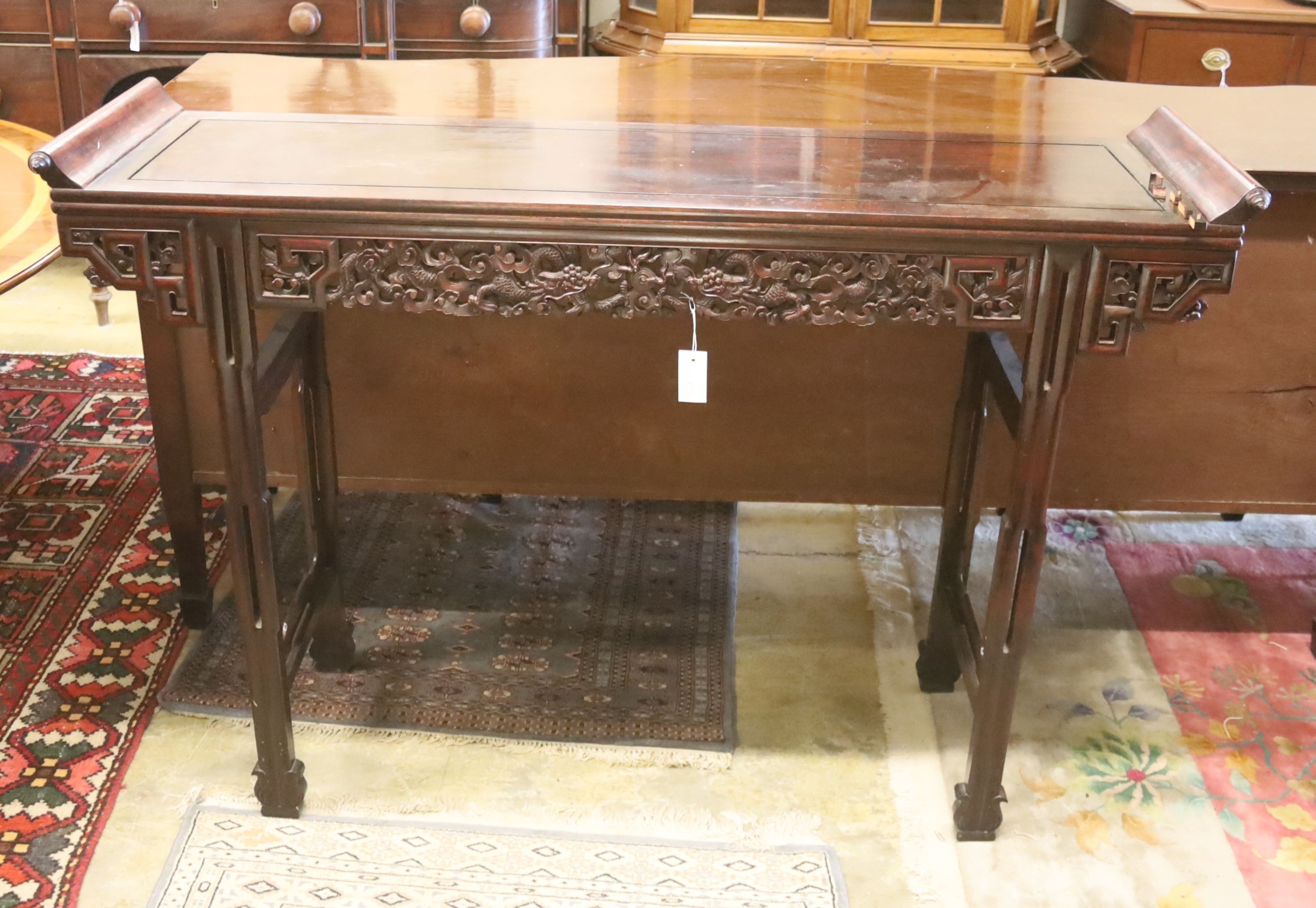 A Chinese altar table, width 150cm, depth 45cm, height 102cm
